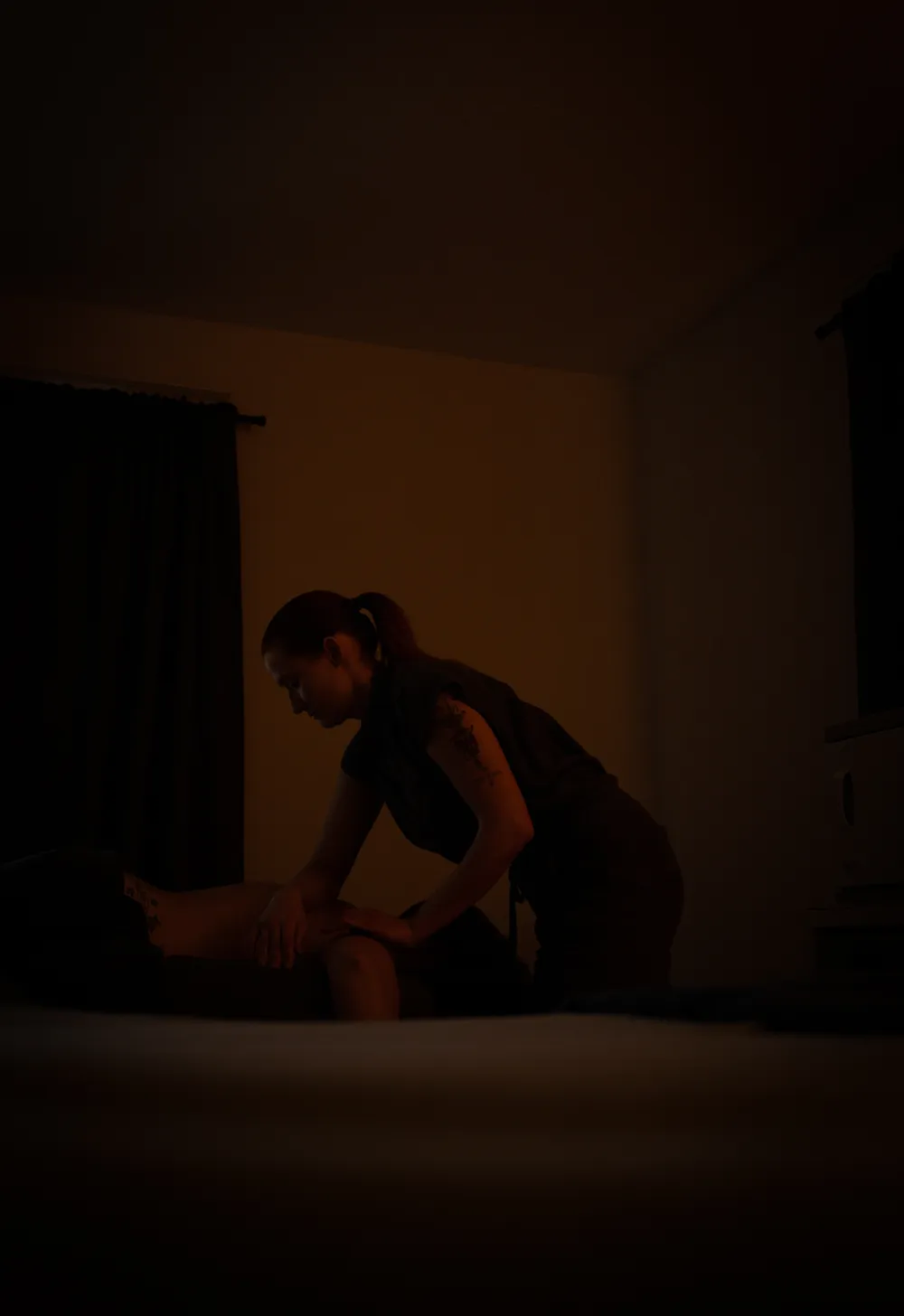 Hand pressing down on a dispenser bottle