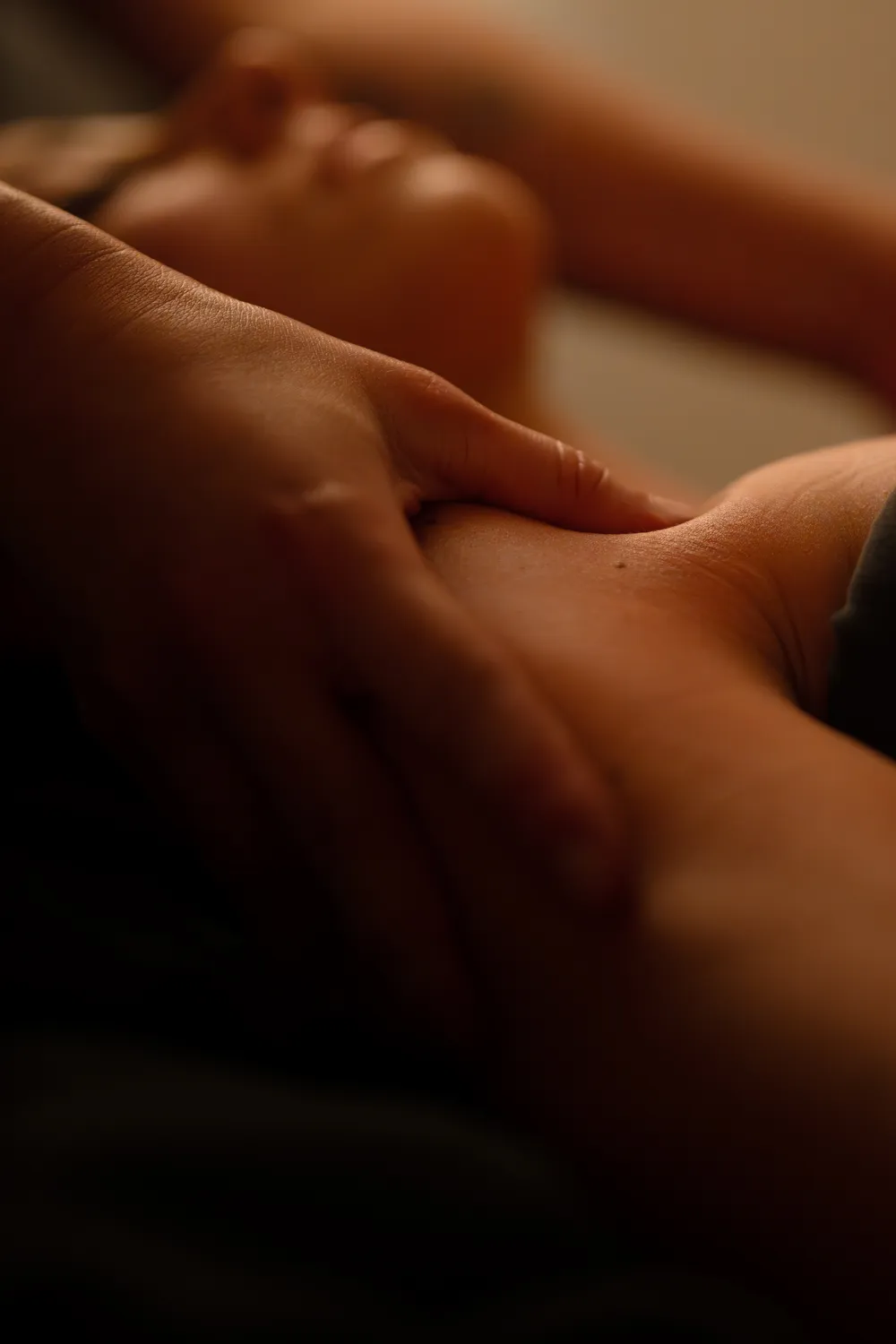 Woman laying down receives a massage